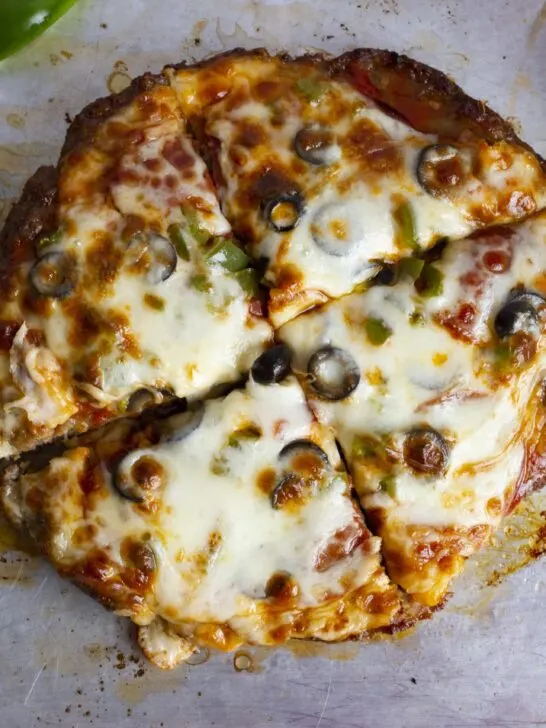 Crustless meat lovers keto pizza ready in under 30 minutes. Grain free, nut free, carnivore friendly, low carb, and keto friendly.