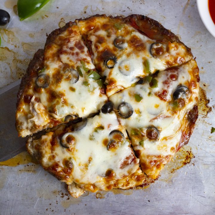 Crustless meat lovers keto pizza ready in under 30 minutes. Grain free, nut free, carnivore friendly, low carb, and keto friendly.