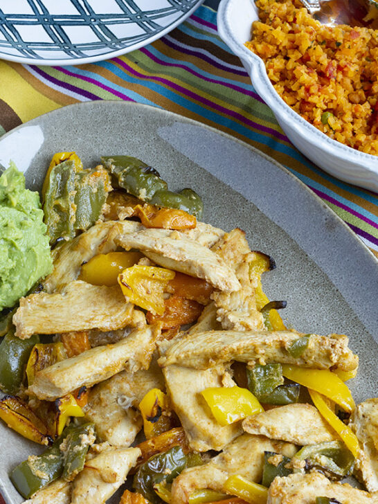 Keto friendly chicken fajitas made easy with this 30 minute meal! Clean ingredients, fast prep, and full of flavor! Less than 4 net carbs per serving!