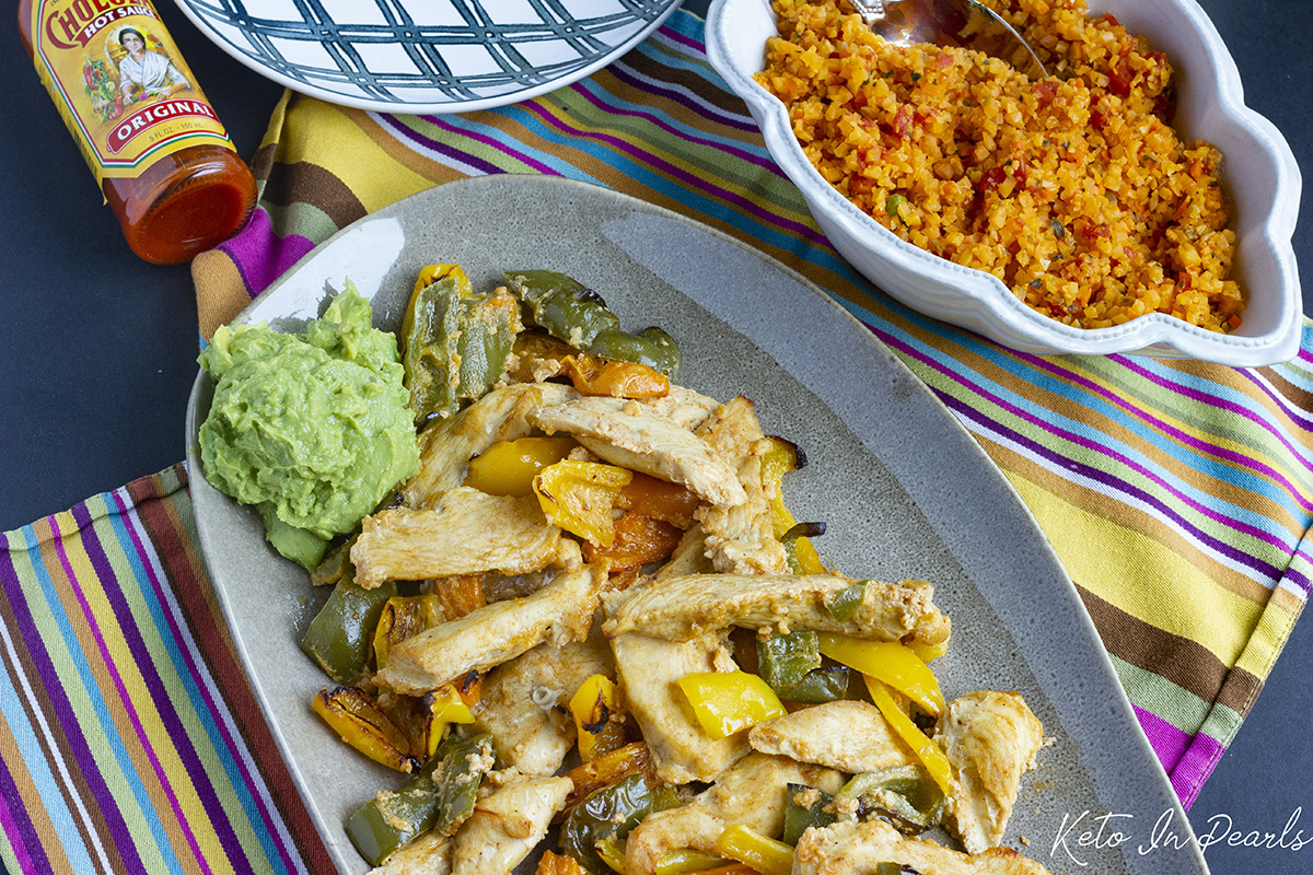 Keto friendly chicken fajitas made easy with this 30 minute meal! Clean ingredients, fast prep, and full of flavor! Less than 4 net carbs per serving!