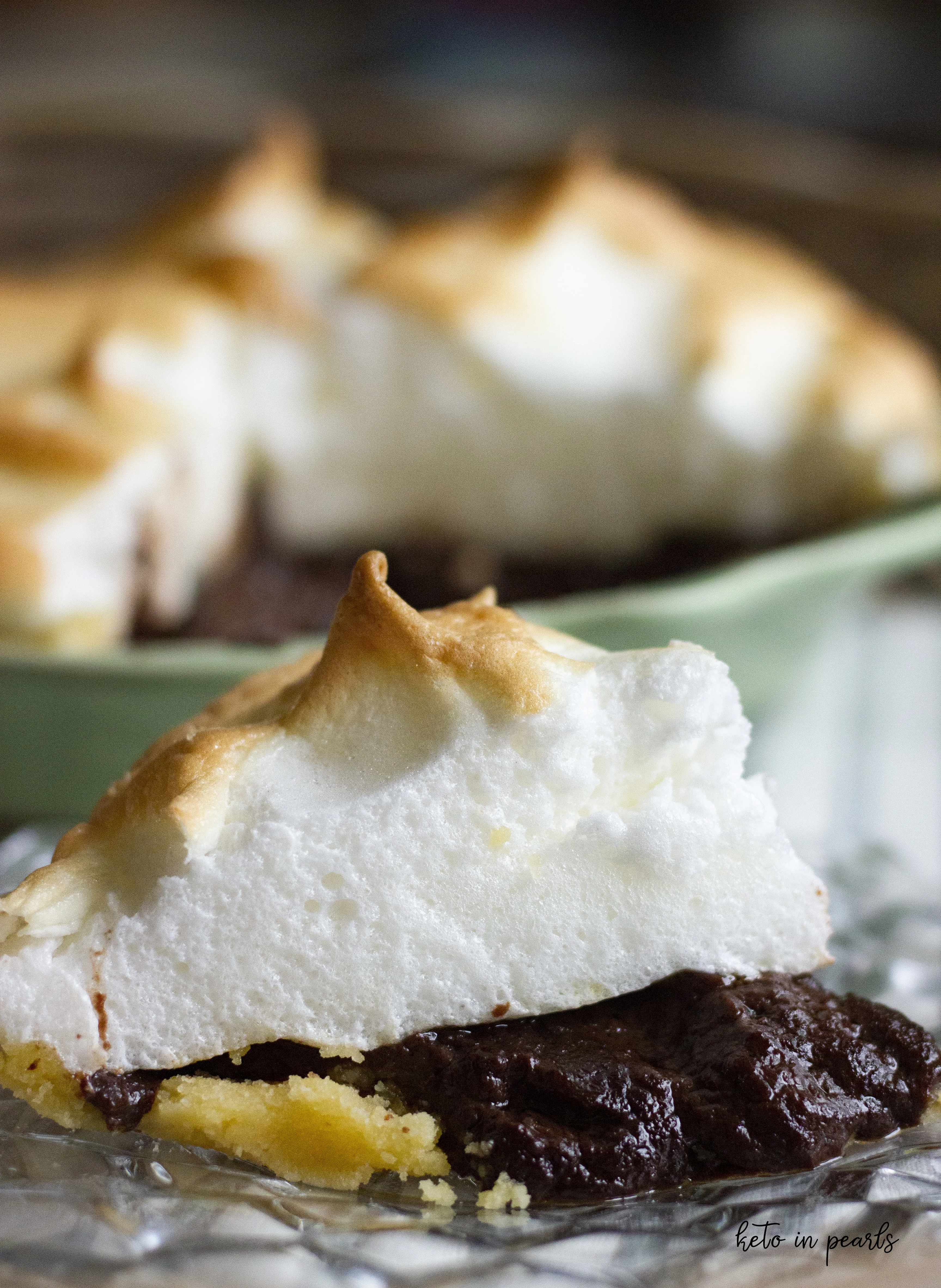Keto chocolate pie with mile high meringue. Only 3 net carbs per serving and basic ingredients!