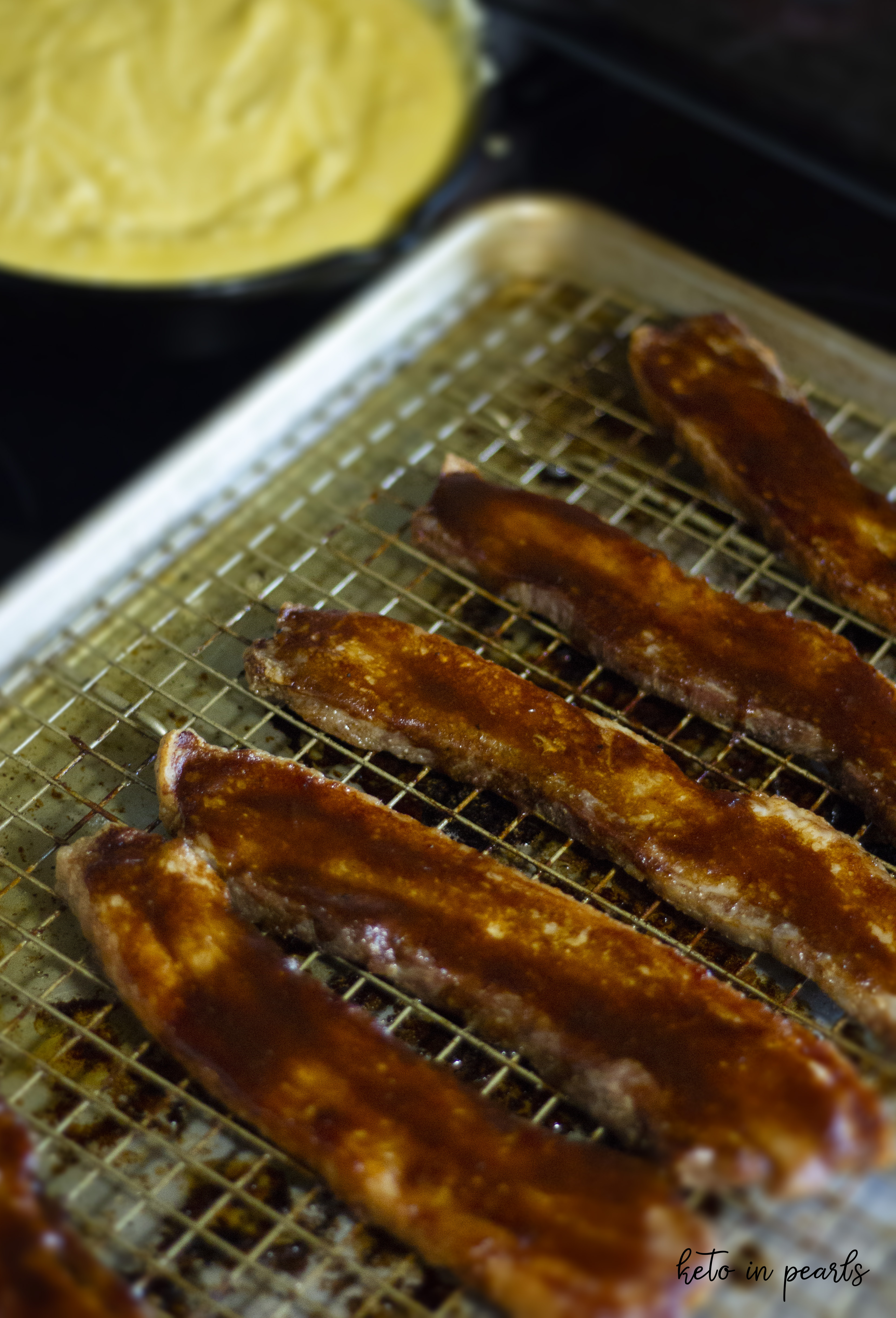 Thick pieces of BBQ pork belly are baked until crispy and slathered with a smokey hot BBQ sauce. Only 1 carb per bite!