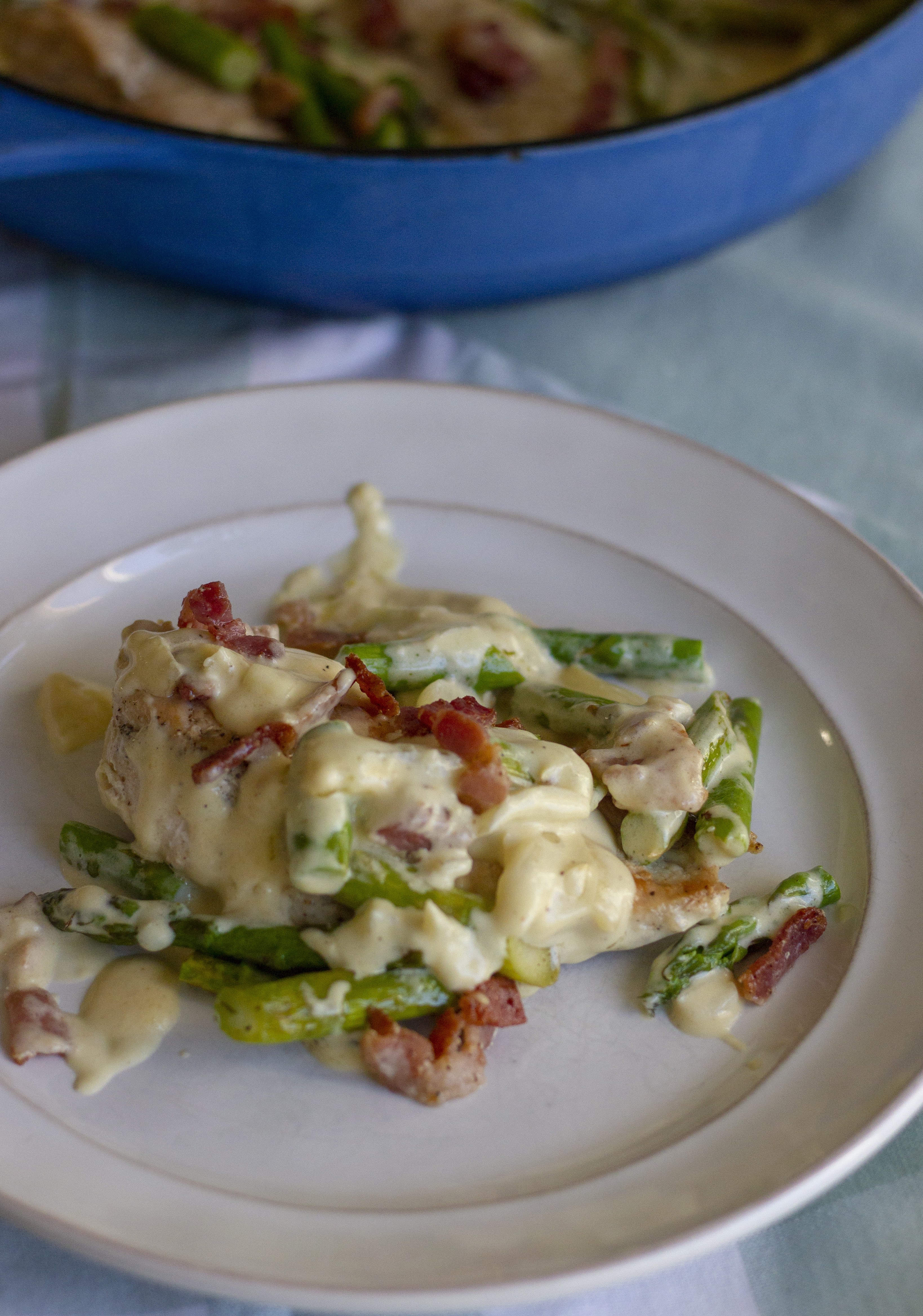 A simple keto chicken dinner ready in 30 minutes. Chicken breasts are sautÃ©ed with bacon and asparagus and topped with a robust white cheddar mornay sauce. Only 8 net carbs per serving.