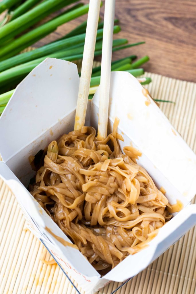 Keto lo mein served in a Chinese takeout box. 