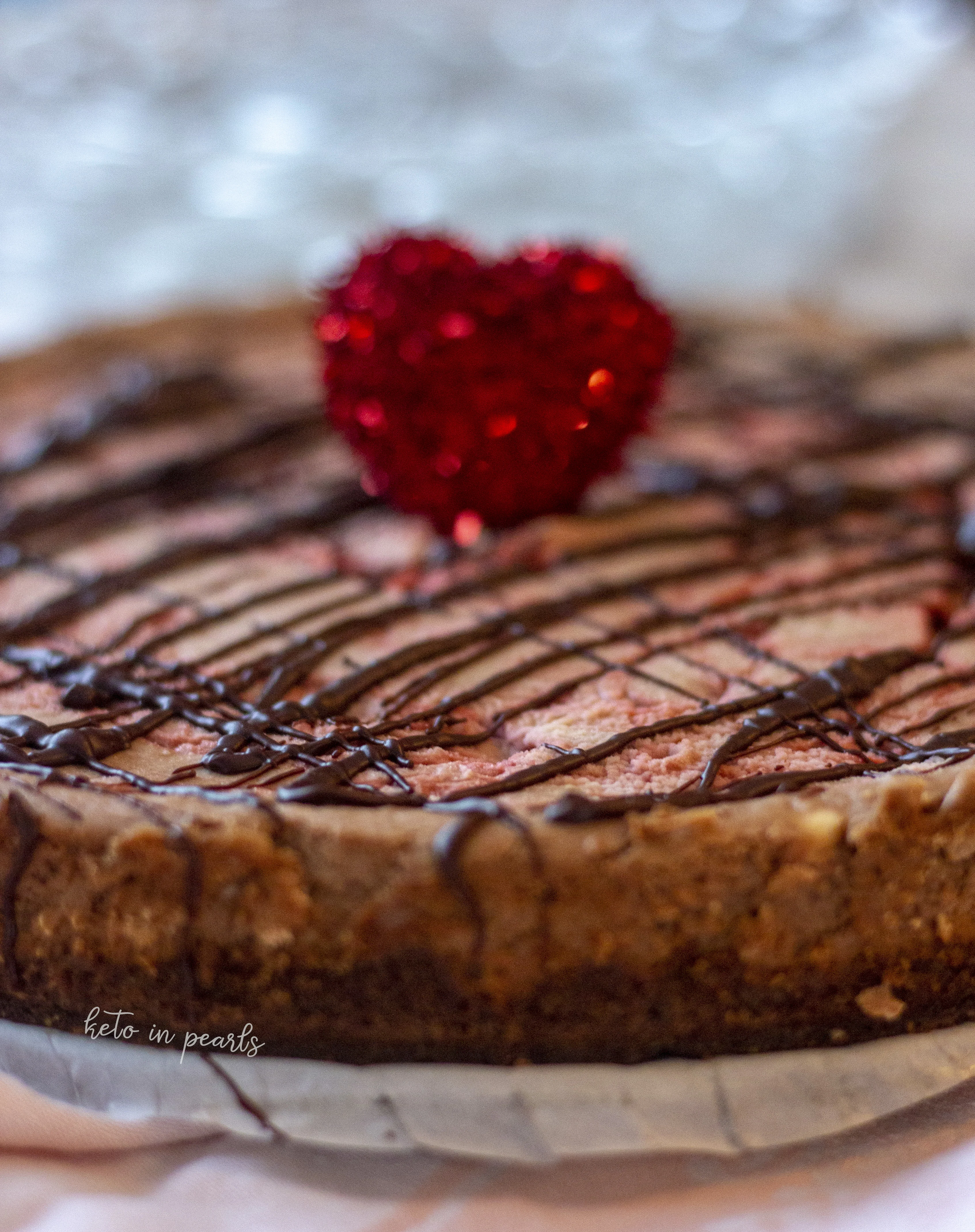 A keto cheesecake with decadent dark chocolate and bright notes of raspberry rests on a chocolate cookie crust. If you’re a keto chocoholic, you will love this Dark Chocolate Raspberry Keto Cheesecake.