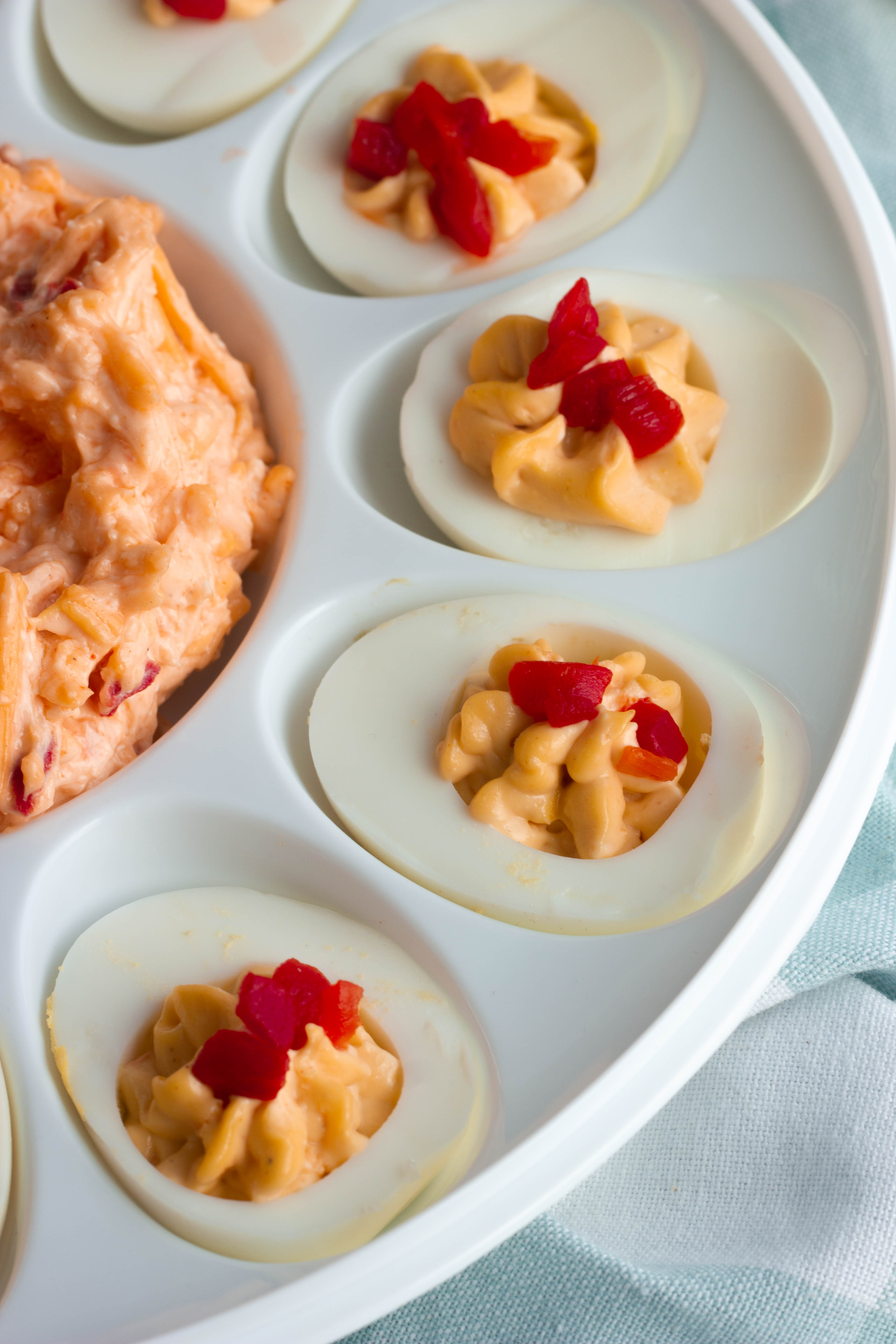 Classic deviled eggs give a nod to the South with these Pimento Cheese Deviled Eggs. A zero carb keto snack perfect for egg fasts or a Masters viewing party!