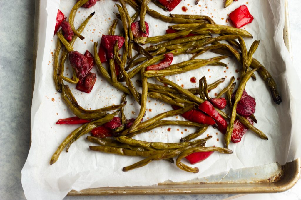 Crisp green beans are roasted with sweet strawberries in a balsamic glaze. A low carb and low calorie side dish for the summer!
