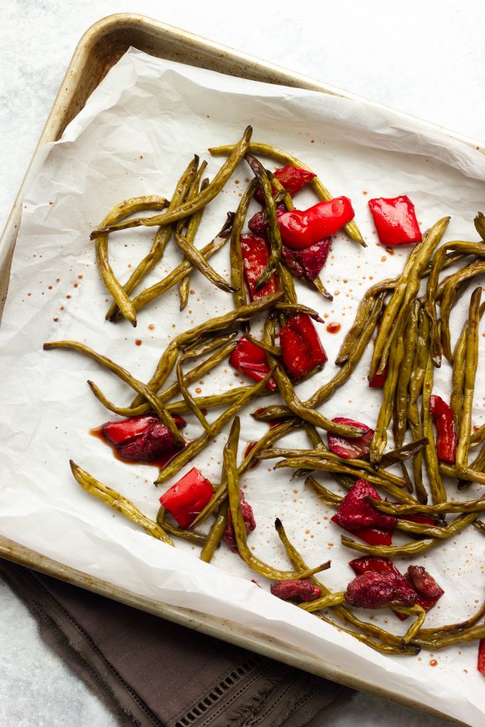Crisp green beans are roasted with sweet strawberries in a balsamic glaze. A low carb and low calorie side dish for the summer!