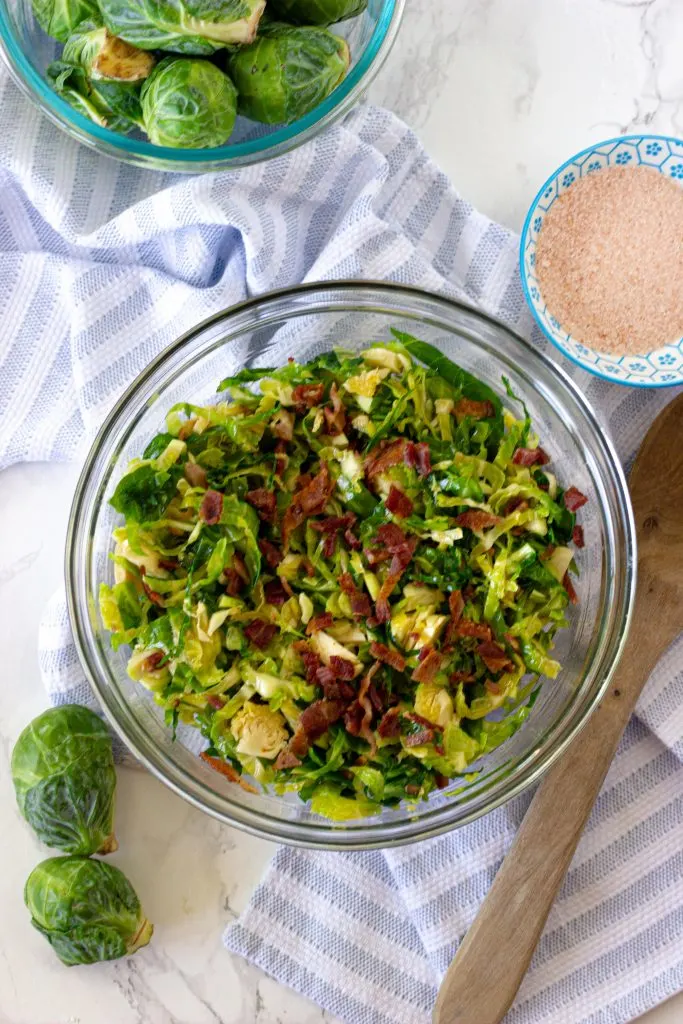 Keto brussel sprout salad with bacon. 3.5 net carbs per serving. A dairy free keto recipe with no oven required.