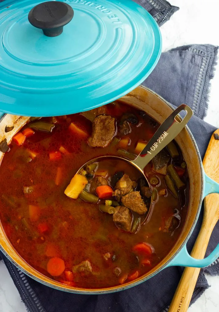 Savory and hearty low carb vegetable beef soup is a one bowl meal that will keep your belly warm and full on a cold night! Keto, paleo, whole30 compliant.