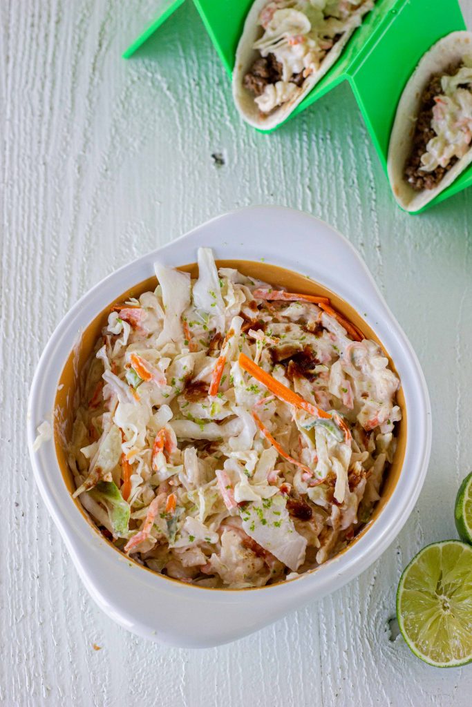 This chipotle lime low carb Mexican coleslaw is a fun and spicy way to top off your favorite tacos, taco salads, or even serve alongside your favorite Mexican dishes! This dairy free, keto, and paleo spicy chipotle coleslaw is just what you need for your future keto tacos.