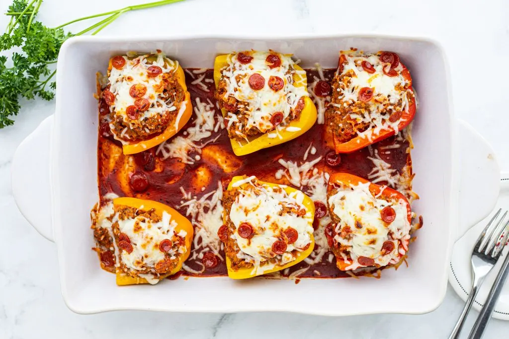 Next time the pizza craving hits, satisfy it with these low carb pizza stuffed peppers! They're the perfect alternative for a keto friendly pizza night. Plus, they're low carb and kid friendly!