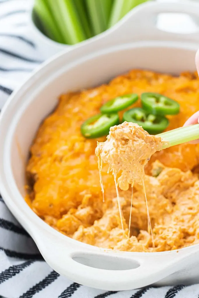 Elevate your three ingredient buffalo dip with this baked keto buffalo chicken dip that's just as easy but ten times more flavorful! Using pre-cooked or rotisserie chicken makes for a fast but drool-worthy keto appetizer!