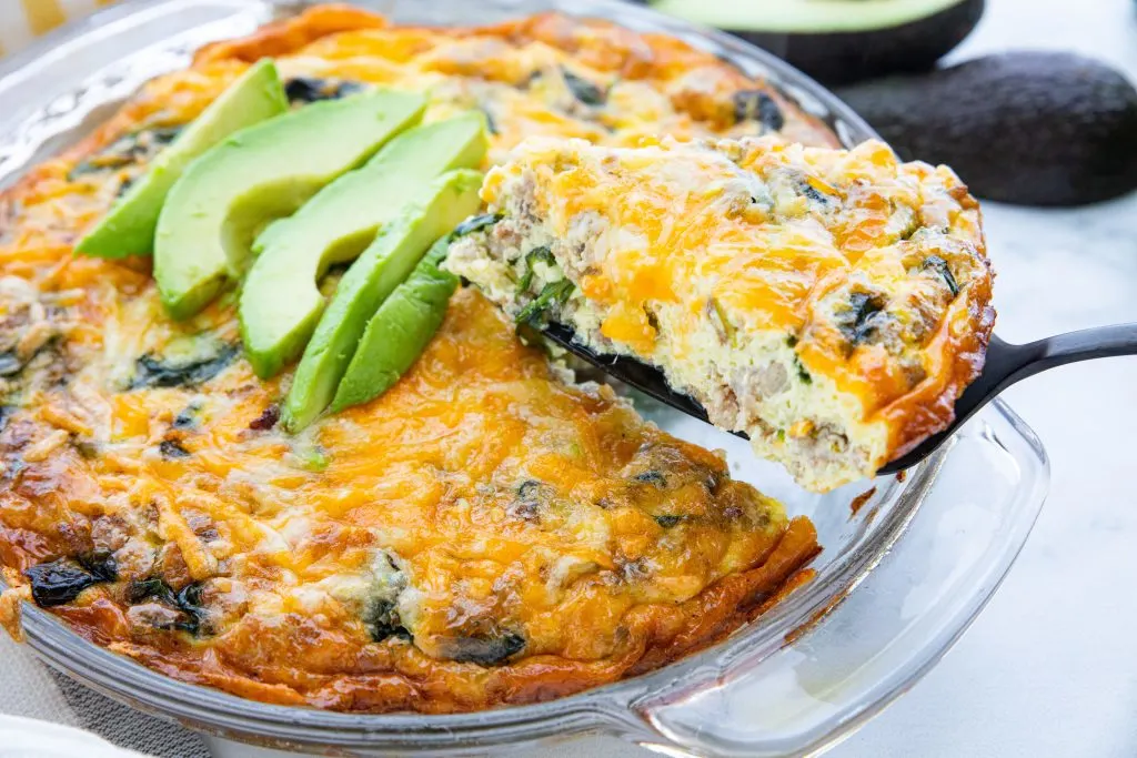 Savory and satisfying, this easy low carb crustless quiche with sausage and spinach is a treat any time of day. Whether it's breakfast, brunch, or dinner, you're going to love this crustless twist on a French classic. 