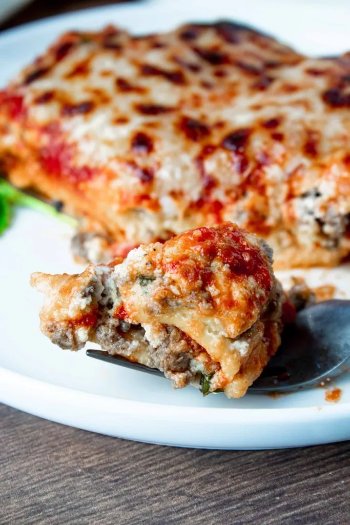 A cheesy, layered, classic keto lasagna with meat sauce and real noodles! This low carb lasagna is hearty and robust and just like a real lasagna should be.