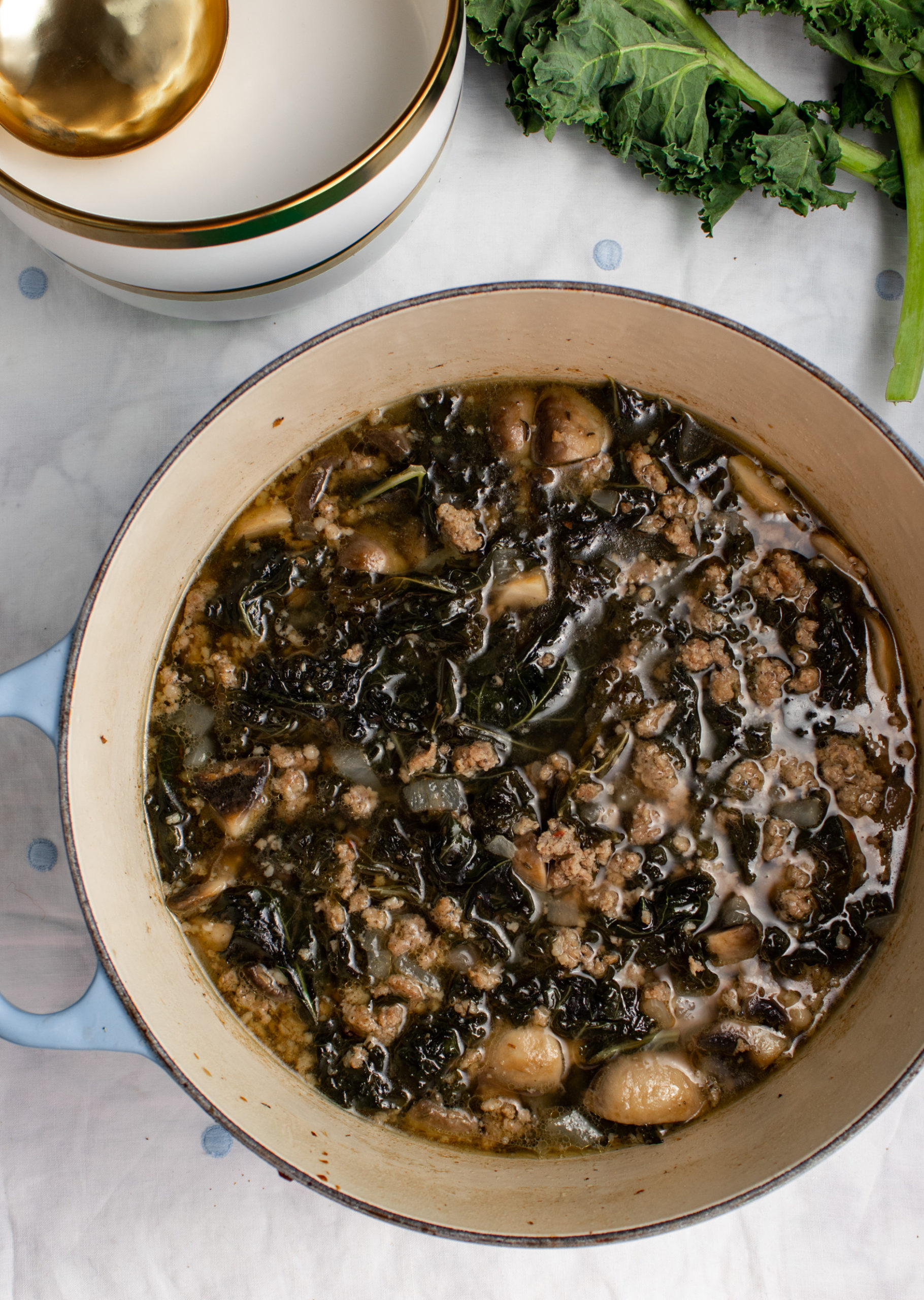 Ready in just 30 minutes on the stovetop, kale and sausage soup is a savory and herbal soup lovely for lunches, meal prep, or to carry to a friend. You're going to love this gluten free, low carb, and clean sausage and kale soup!