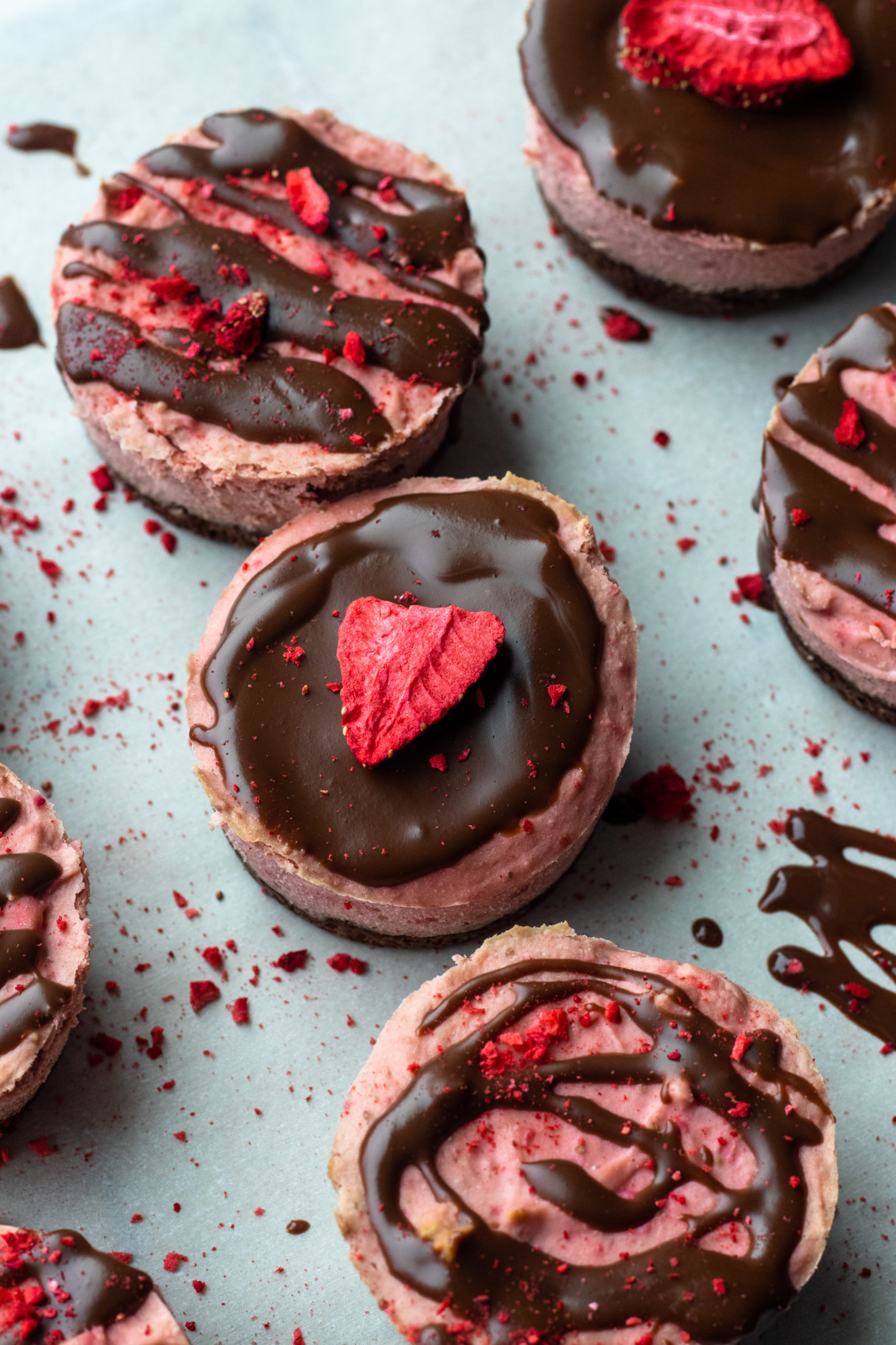 Dark chocolate covered strawberry low carb cheesecakes.