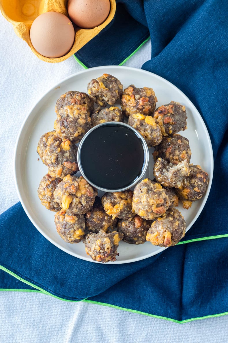 Keto sausage balls with scrambled egg, cheese, and maple syrup