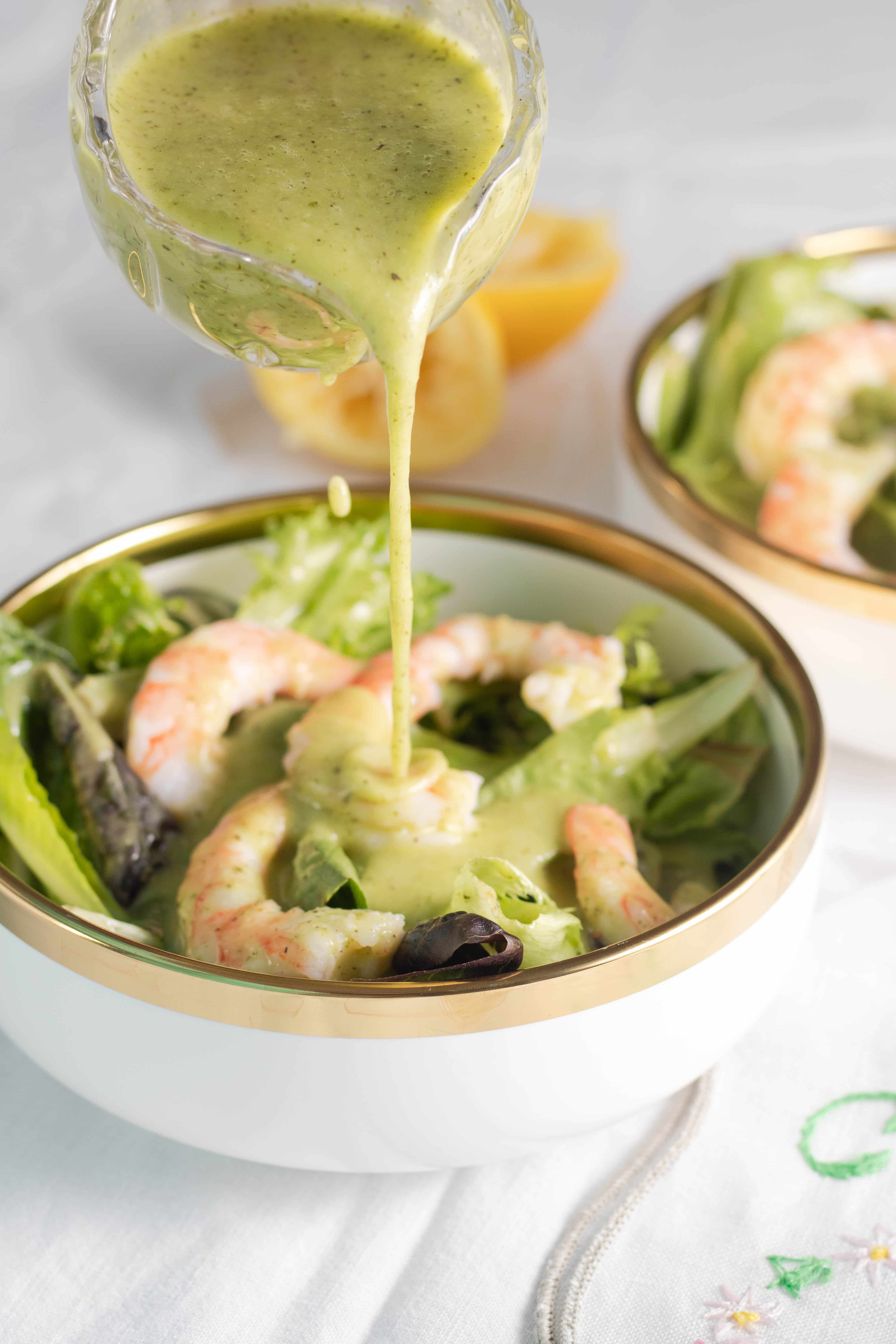 Low carb salad dressing on a salad with shrimp.