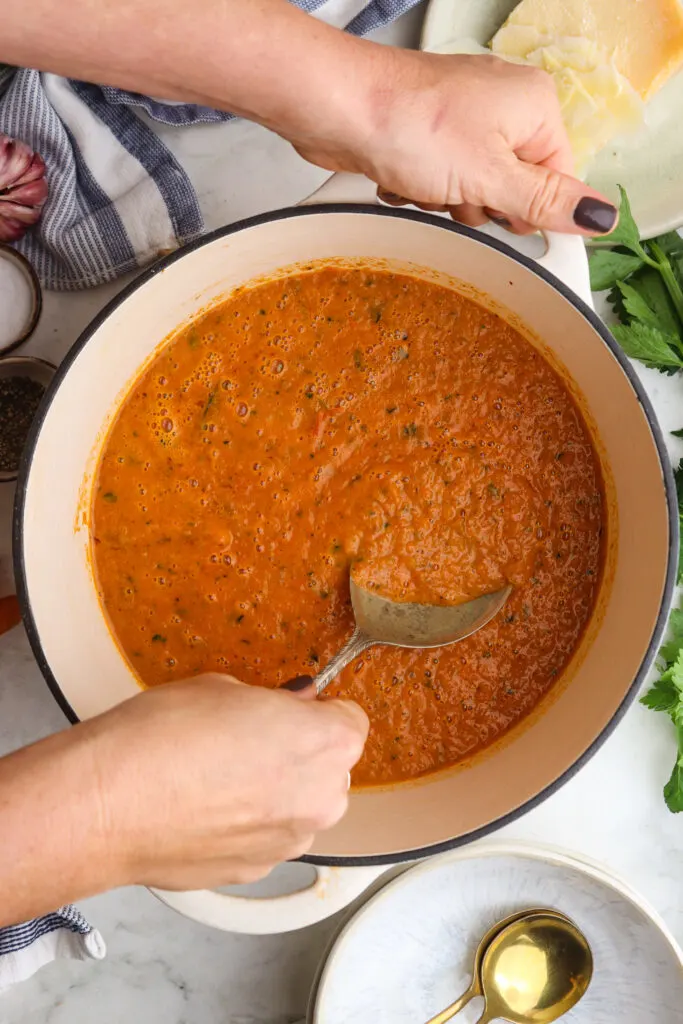 Healthy Roasted Tomato Basil Soup soup with a spoon